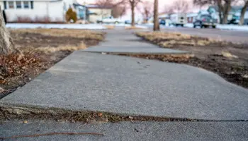 Concrete that has settled and needs to be fixed.